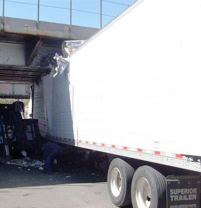 truck stuck under bridge